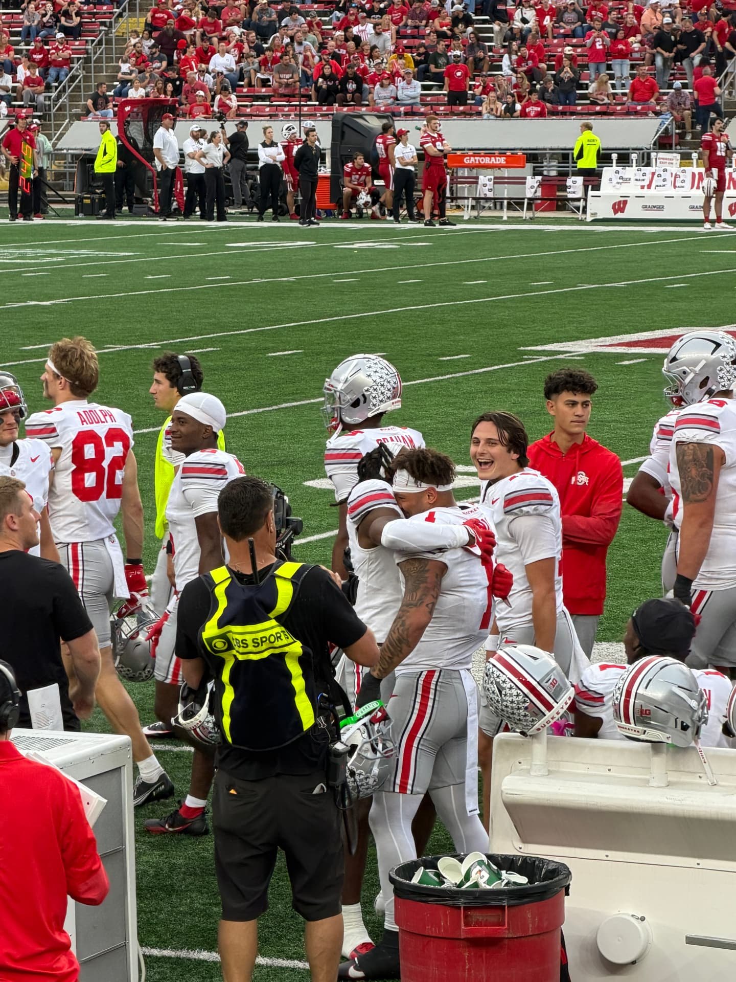 Ohio State players celebrating on the sideline during a road game