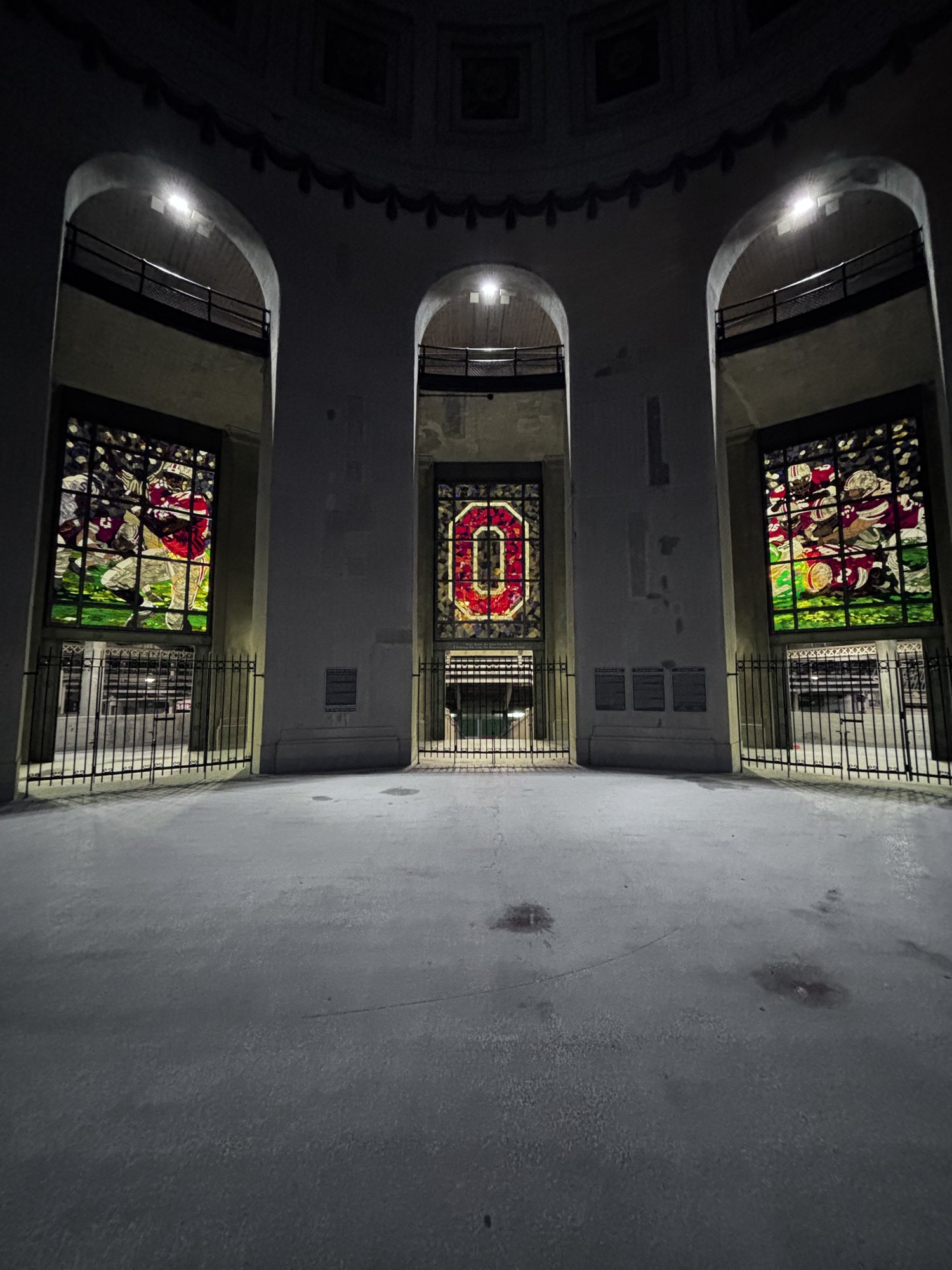 Stained glass windows inside the Ohio Stadium rotunda at night